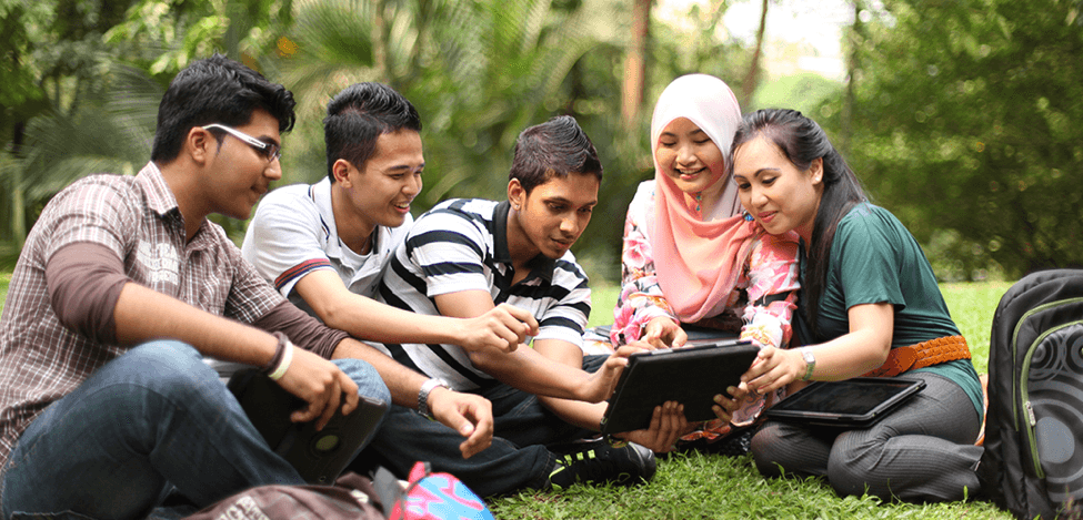 ASEAN students collaborating with digital technology